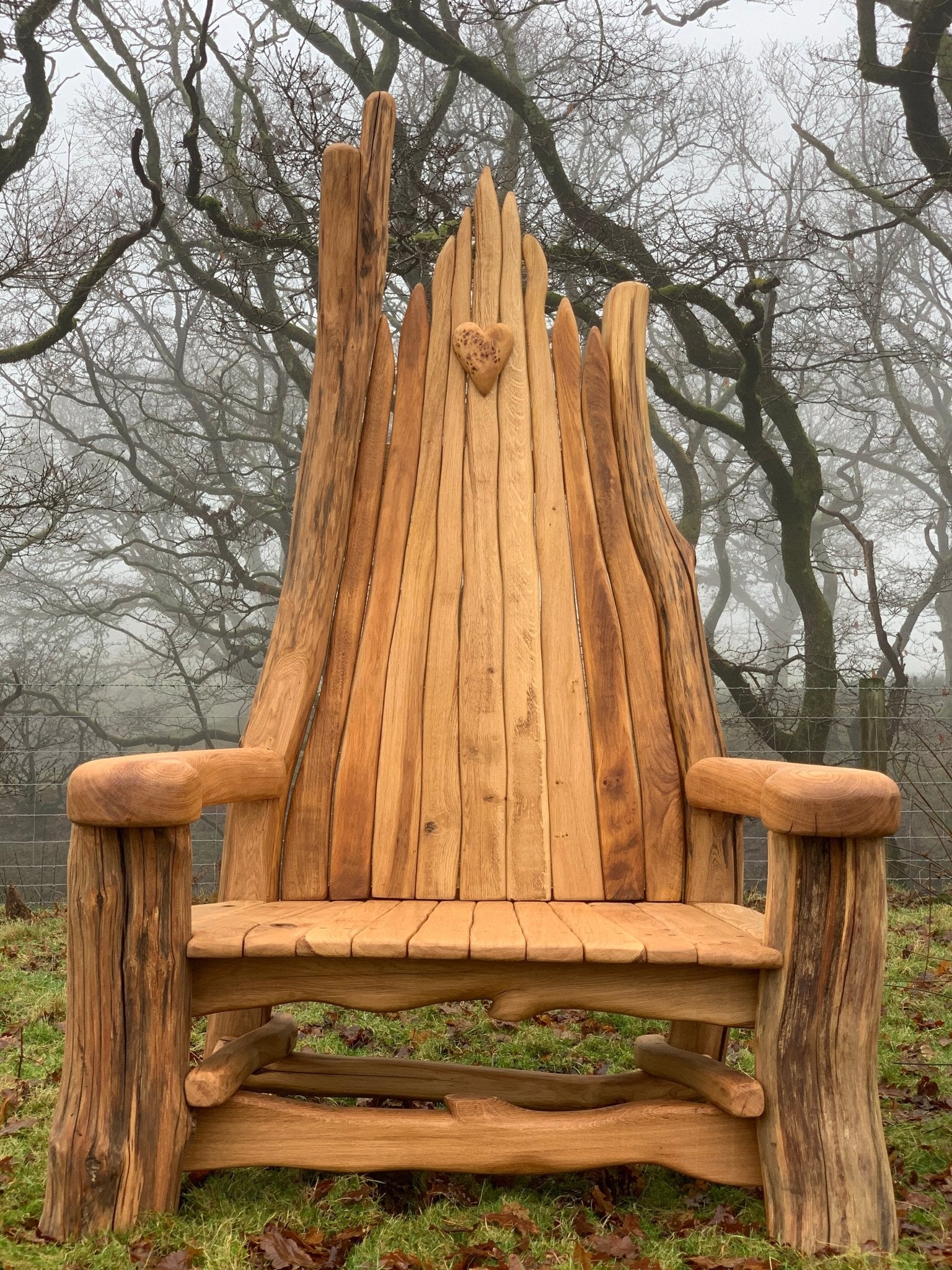 Rustic wooden bench with slatted backrest