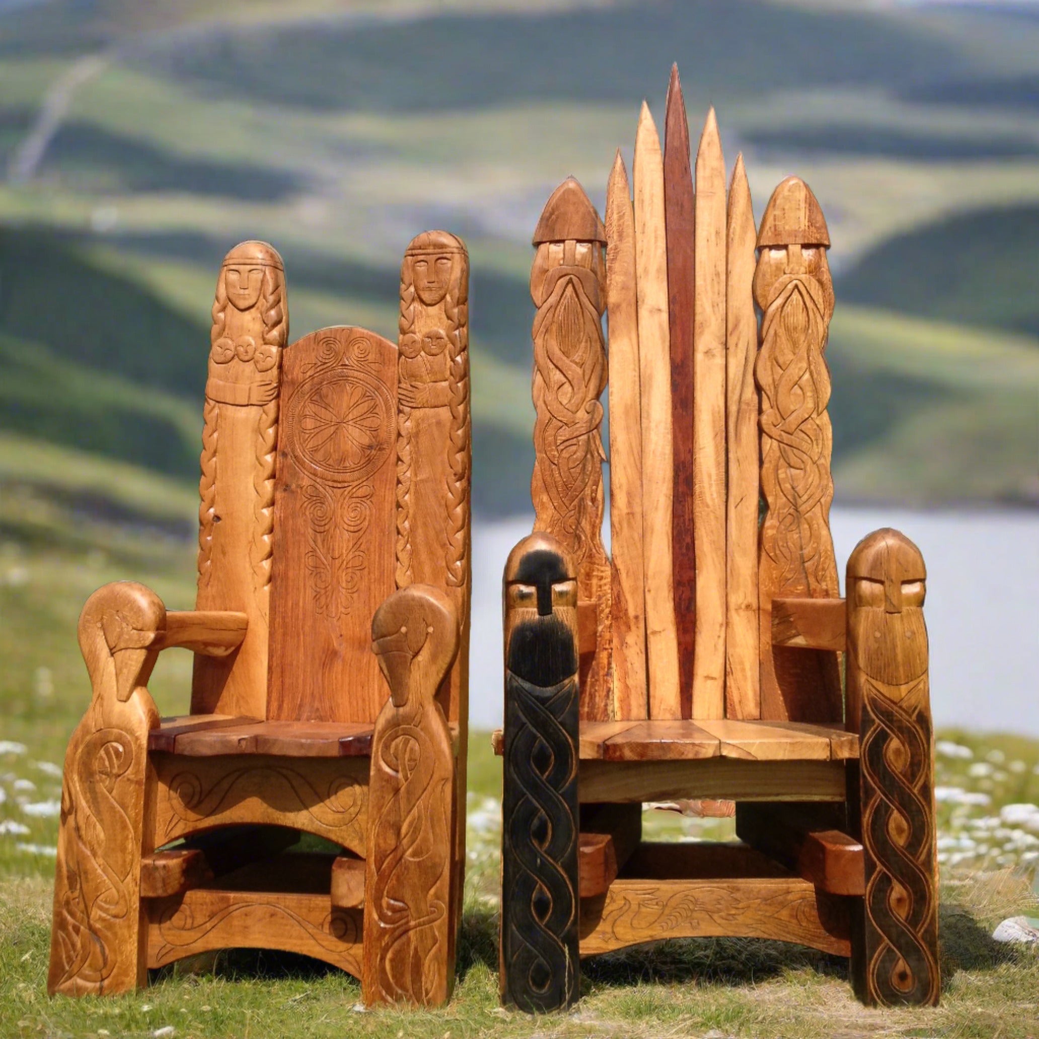 Two Viking-style wooden chairs with carvings