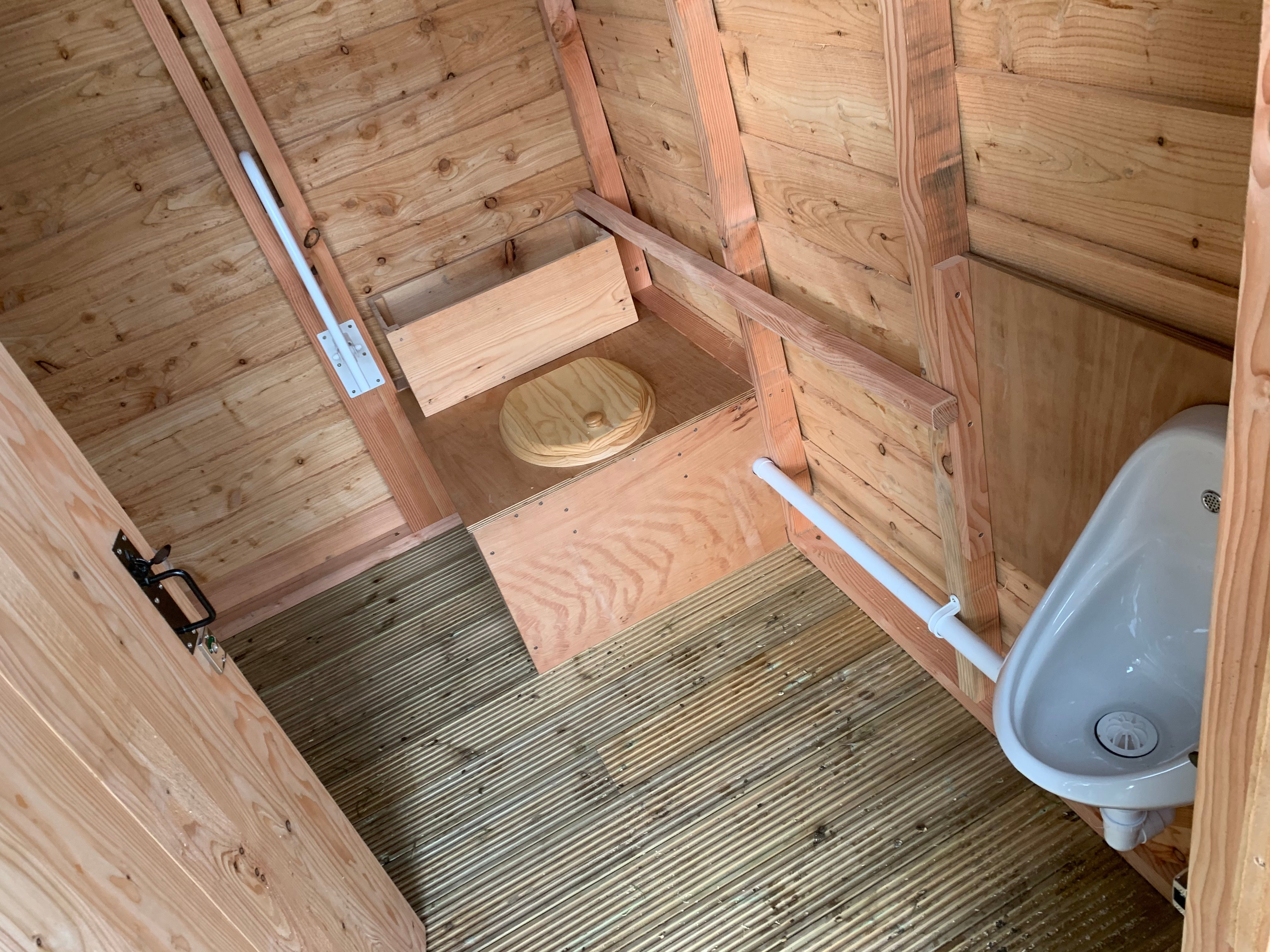 Interior view of compost toilet with urinal