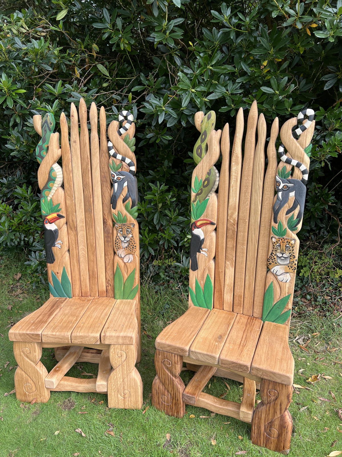 Side view of carved oak wild kingdom throne made for Drusillas Zoo — handmade animal wildlife chair, Wales