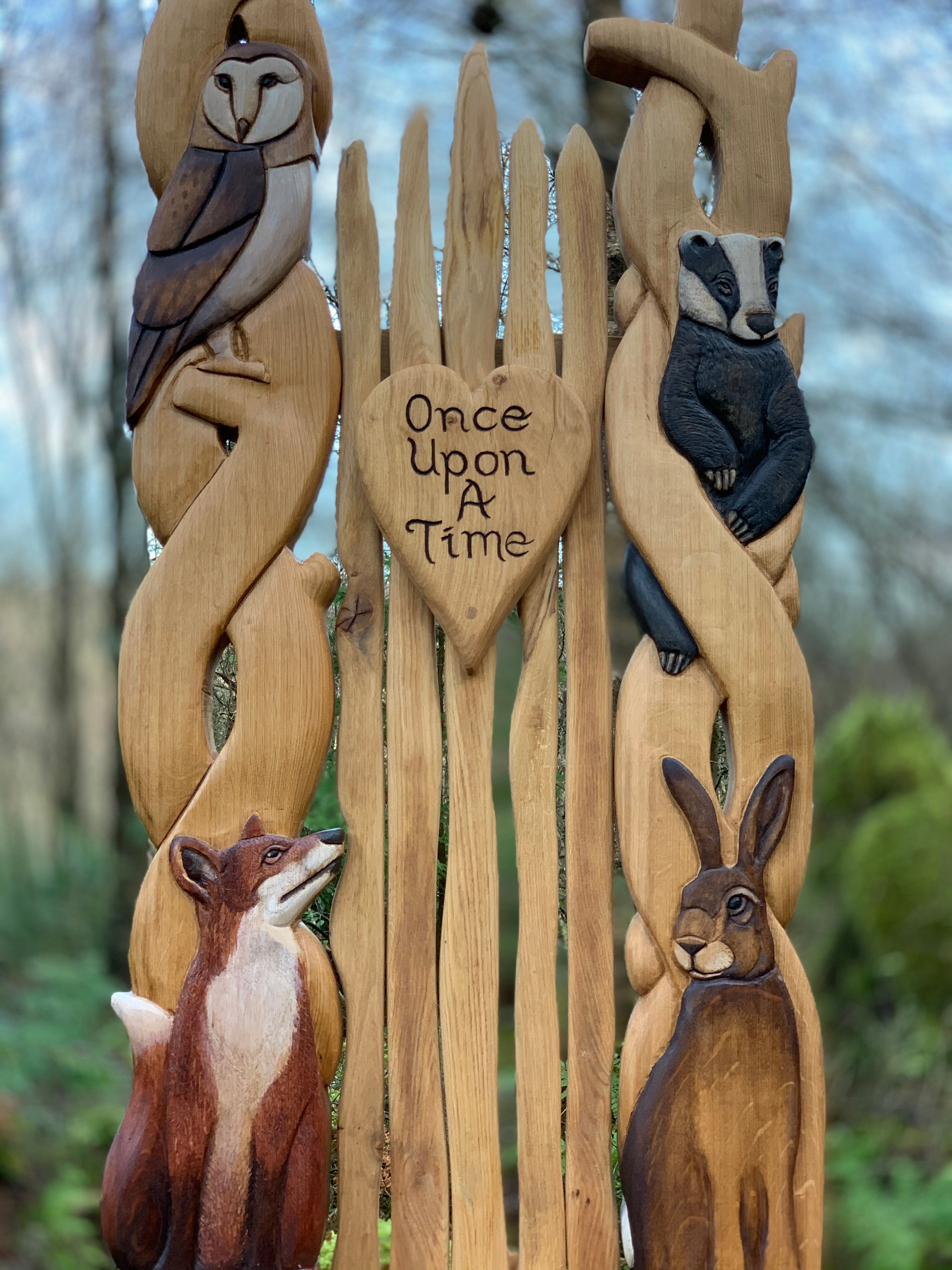 Close-up of animal carvings on wooden chair.