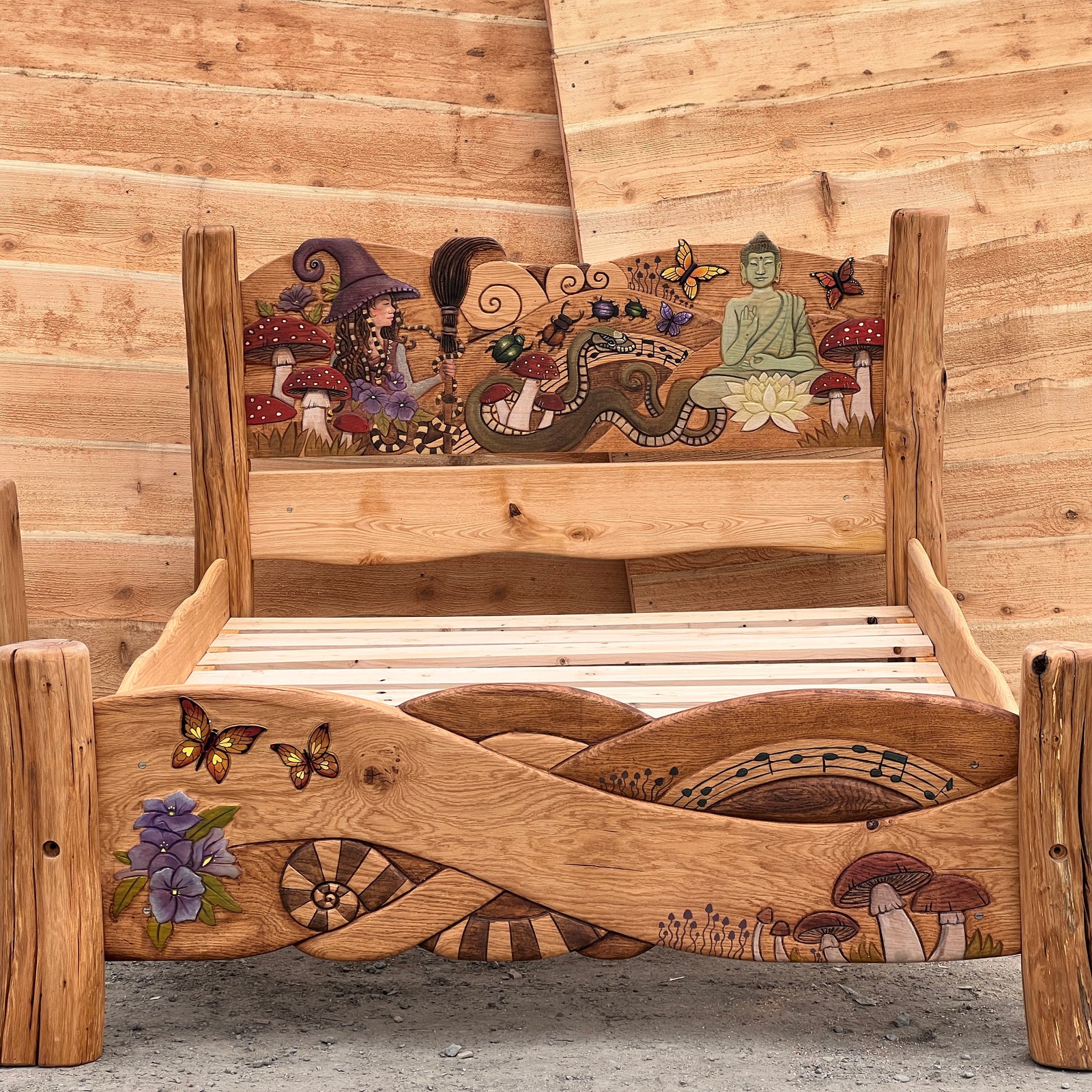 Bespoke fantasy bed commission — solid oak king frame with hand-painted carved scene across headboard and footboard