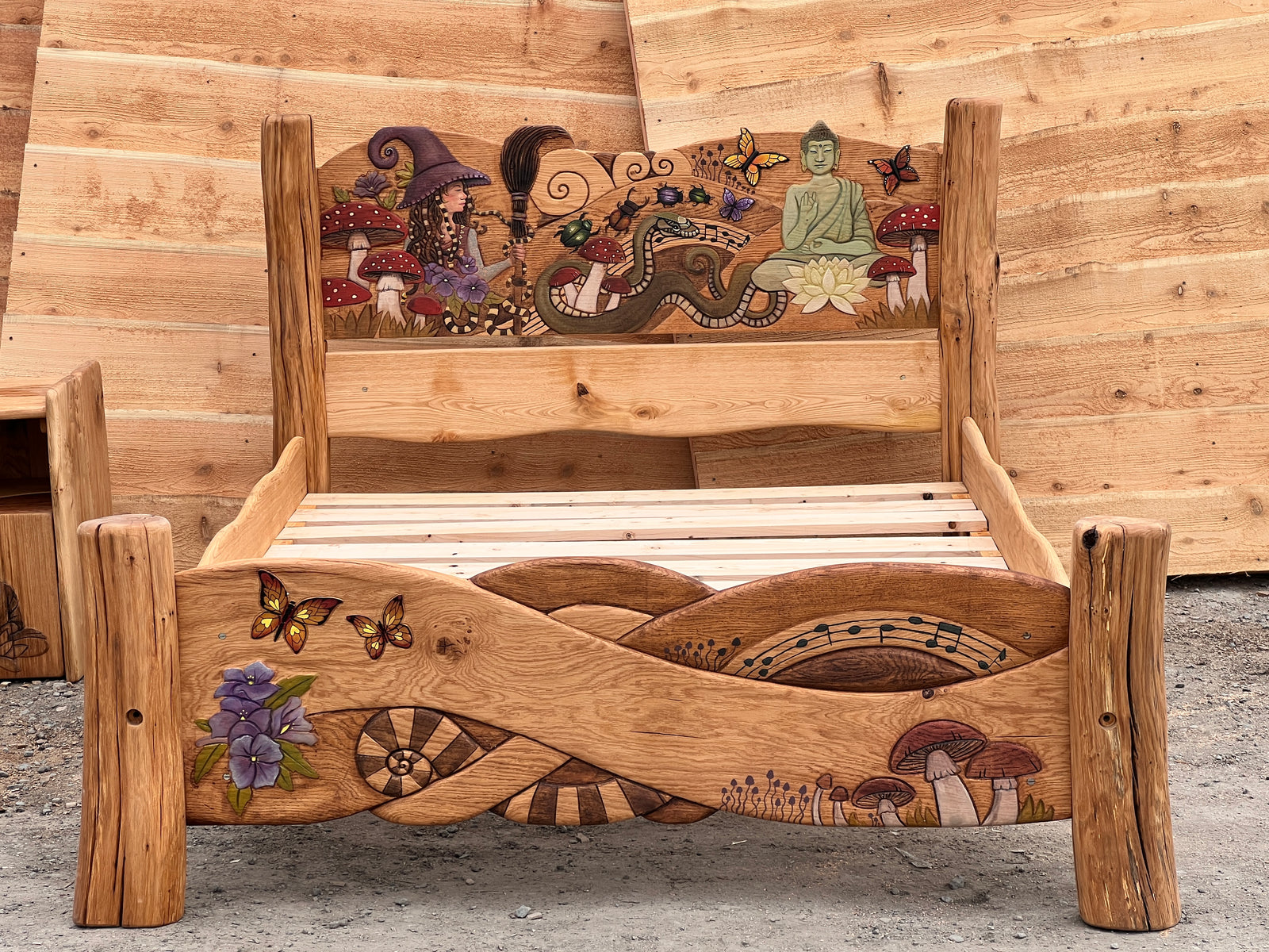 Celtic knotwork footboard with carved butterflies, purple flowers, ammonite spiral and music notes | hand-carved solid oak