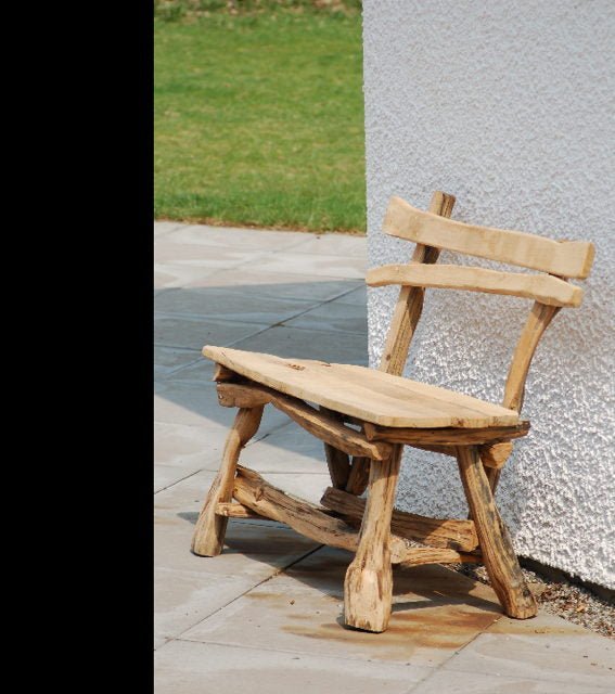 Carved oak garden bench with woodcutter's design — handmade outdoor furniture, Wales