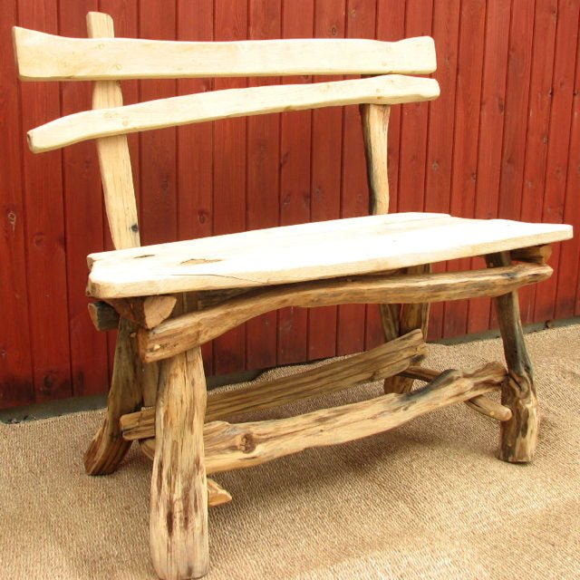 Rustic handcrafted oak woodcutter's garden bench — bespoke outdoor seating, Wales