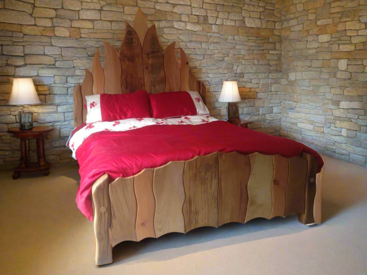 Handcrafted Celtic oak flame bed in castle setting — Viking-inspired solid wood furniture, Wales