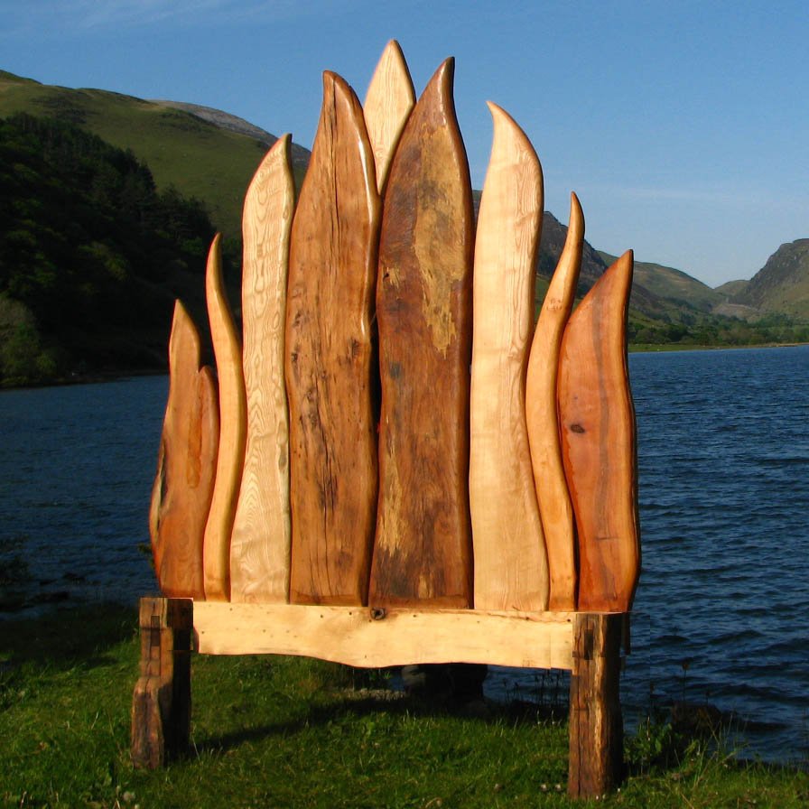 Driftwood and oak Viking flame bed — handcrafted solid wood bedroom furniture, Wales