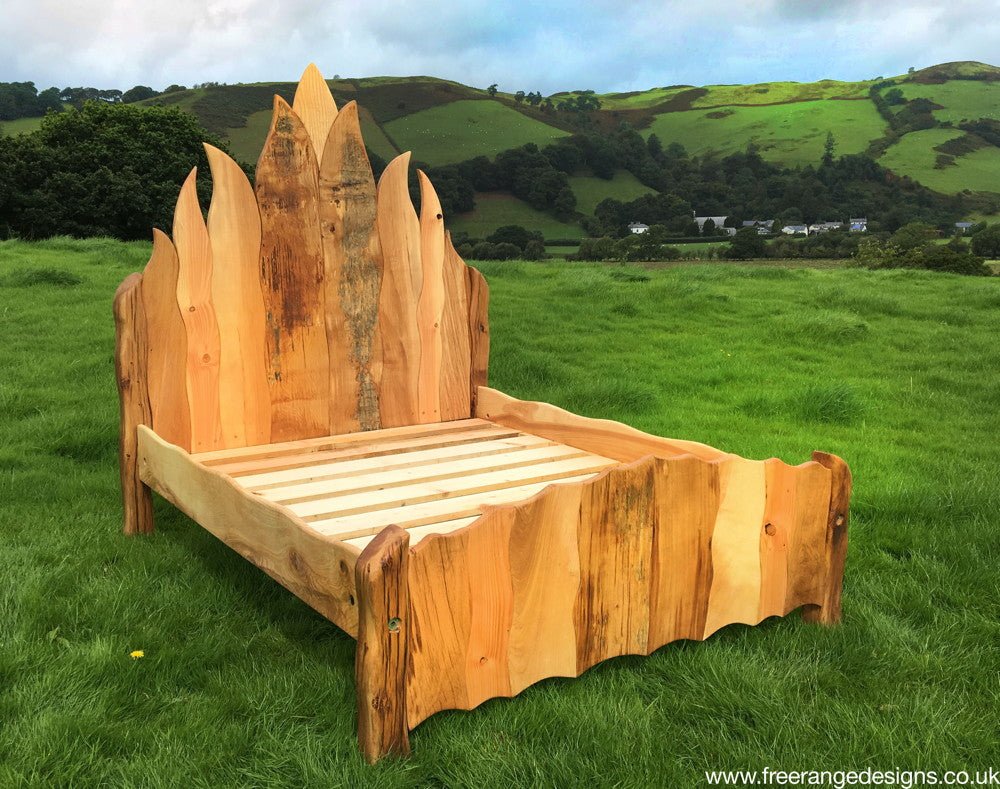 Reclaimed oak solid wood flame bed — handcrafted Viking-inspired bedroom furniture, Wales