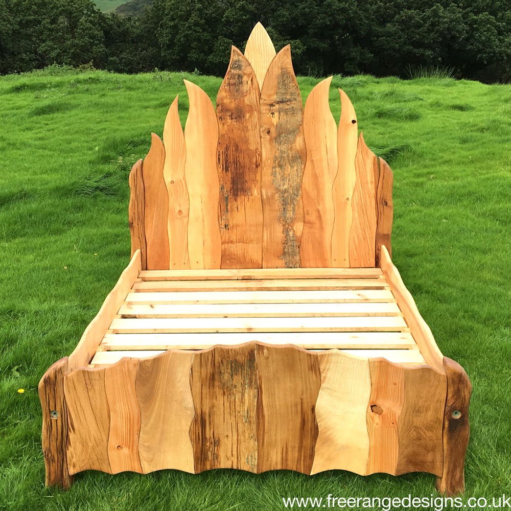 Handcrafted Viking flame oak bed frame — flame-inspired solid wood bedroom furniture, Wales