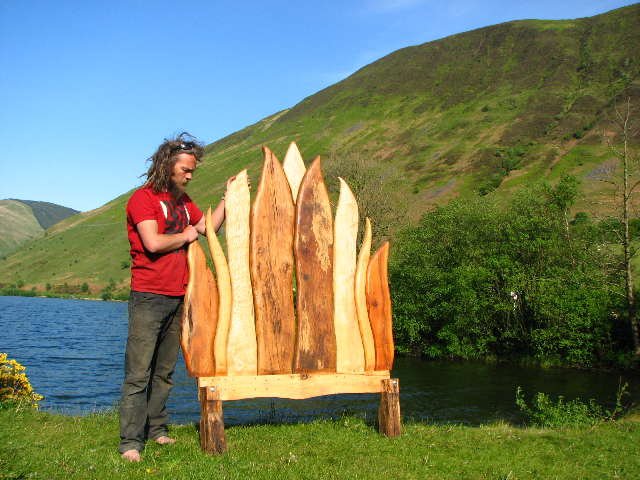 Handmade oak Viking flame bed beside Tal y-llyn lake — solid wood bespoke furniture, Wales
