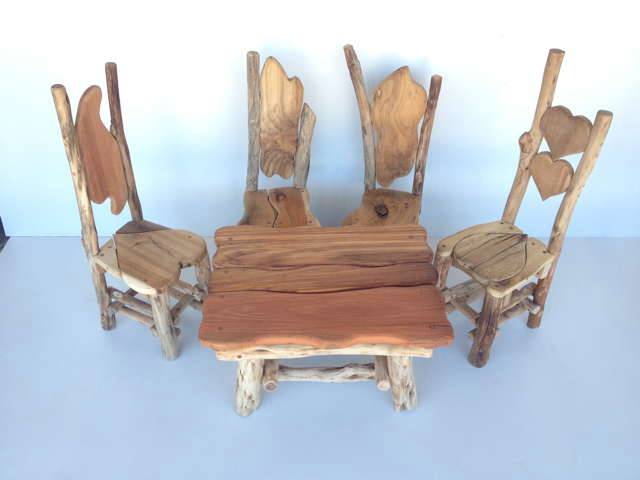 Children seated on handmade natural wood chairs — bespoke organic furniture, Wales