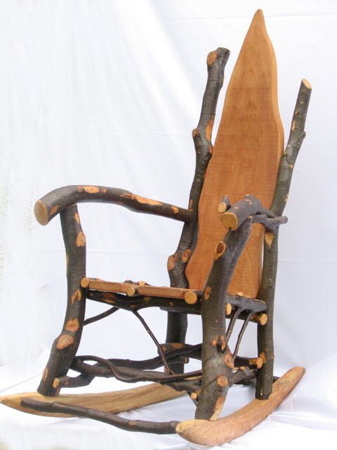 Detail of handmade rustic wooden rocking chair with natural branch back — bespoke organic furniture, Wales