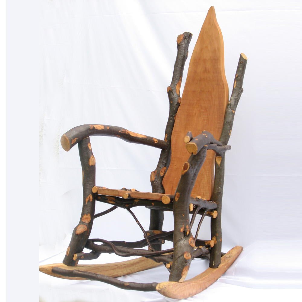 Handcrafted rustic wooden rocking chair with natural branch back — bespoke organic furniture, Wales