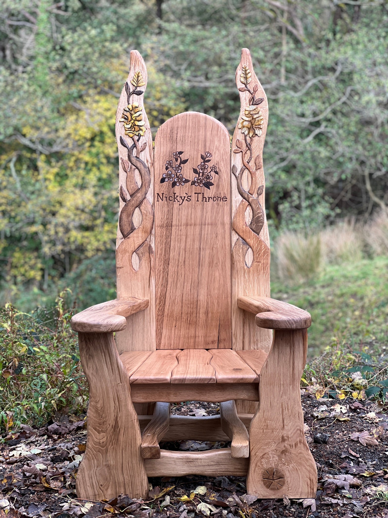 Handmade solid oak throne chair in garden — personalised storytelling chair, Wales