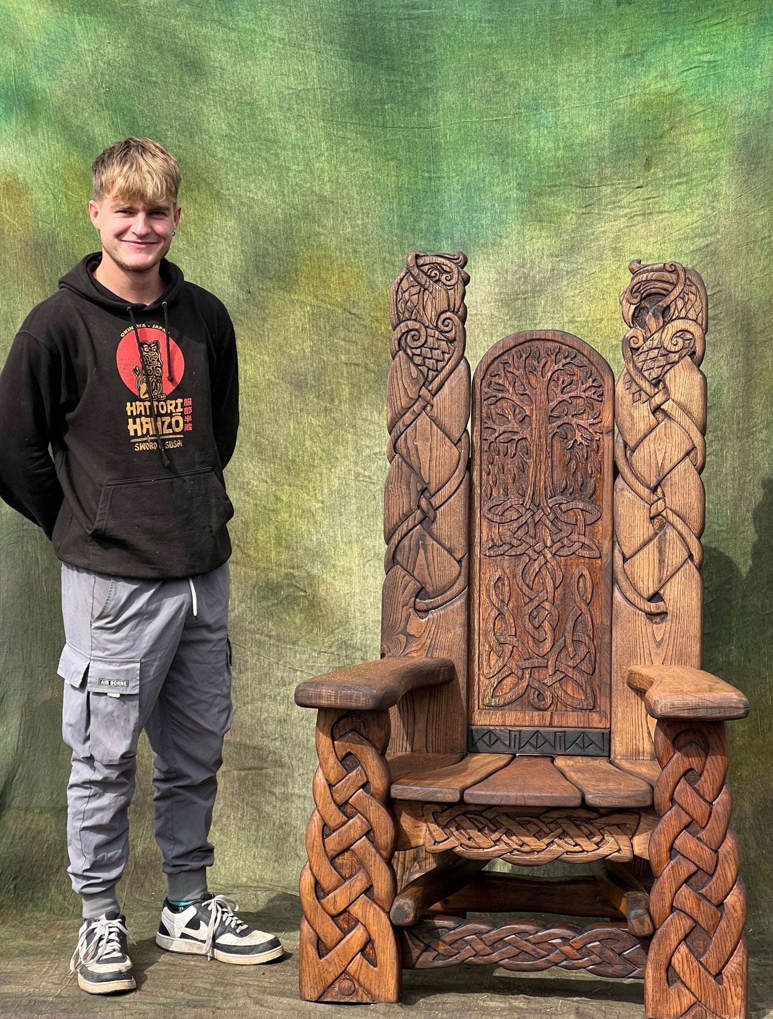 large viking throne chair scale next to person