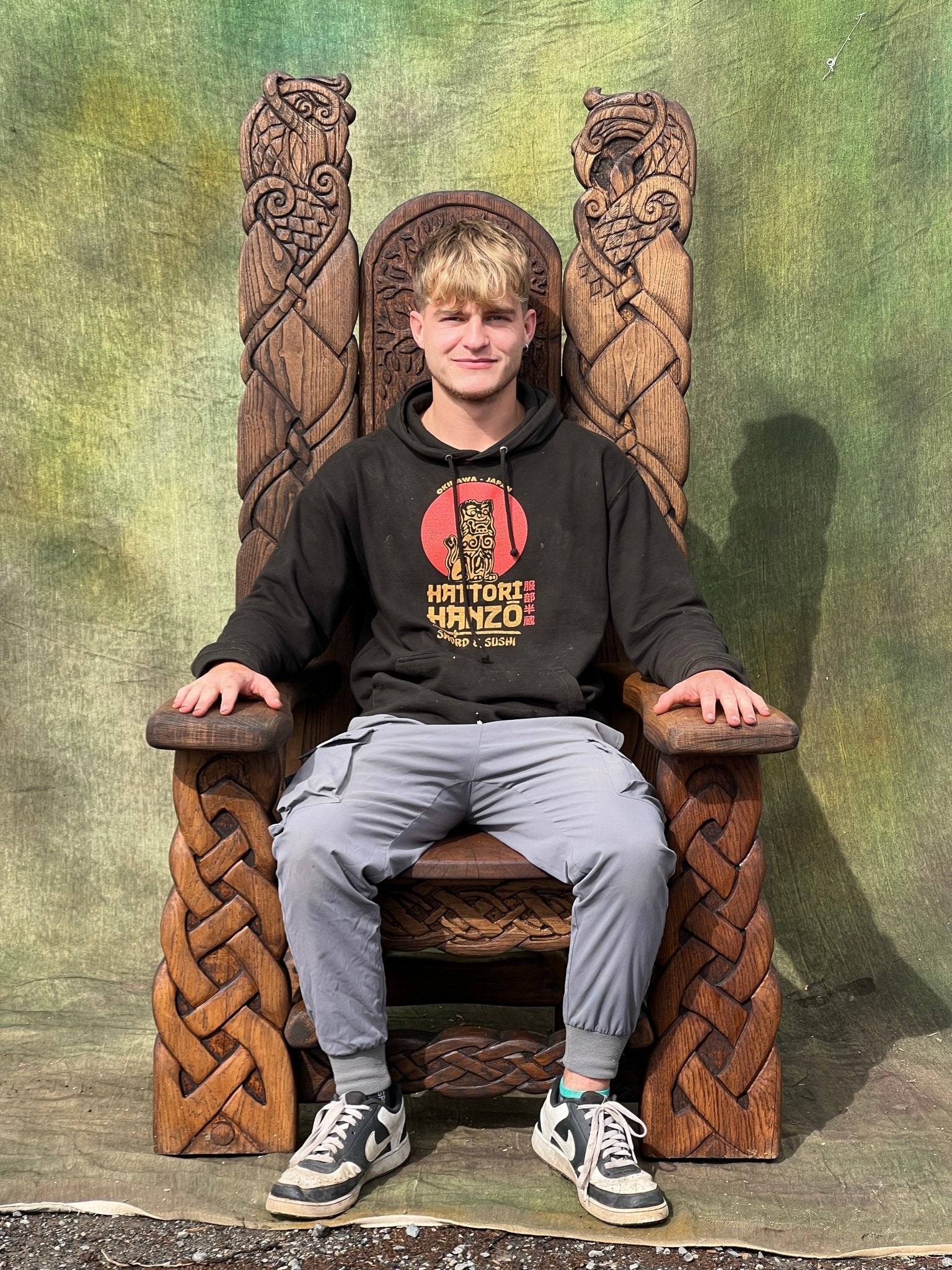 Large Viking throne chair showing scale — handmade carved oak storytelling throne, Wales