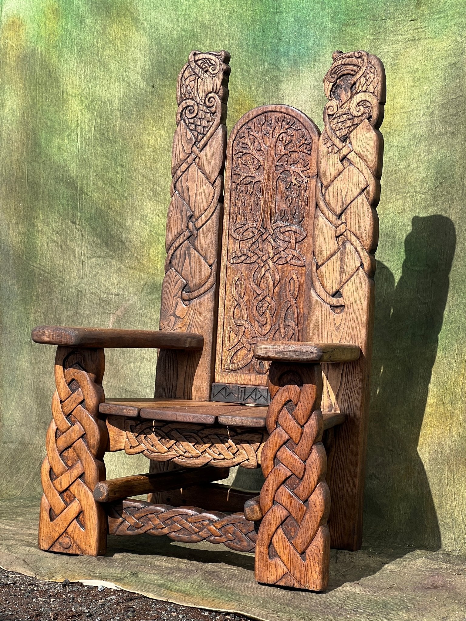 Carved oak Viking chair angled view — bespoke storytelling throne for Celtic bedroom, Wales