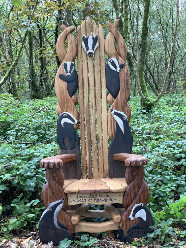 Badger-themed storytelling chair in forest