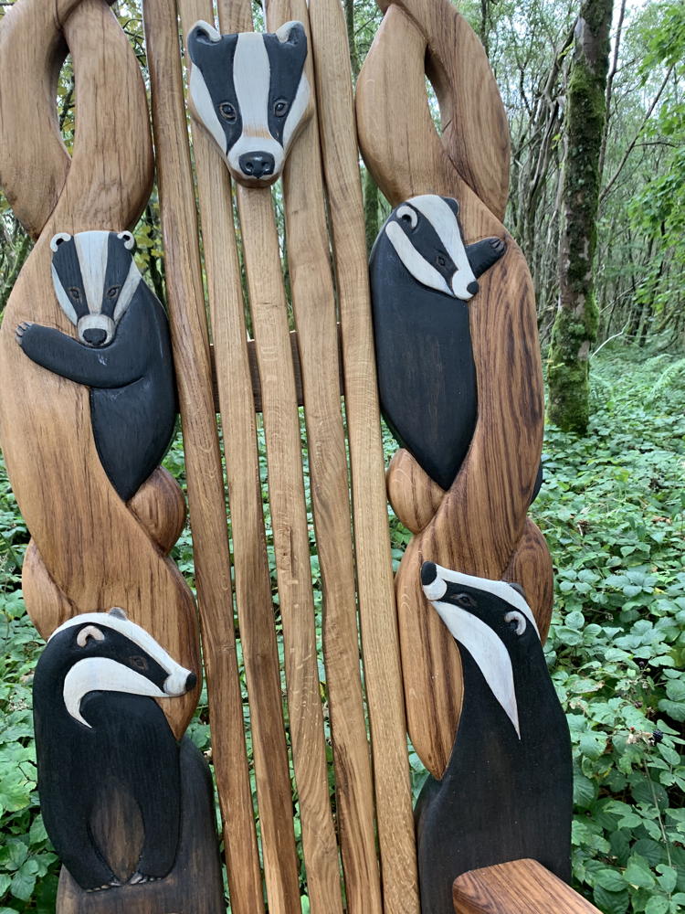 Detailed view of badger carvings on chair back