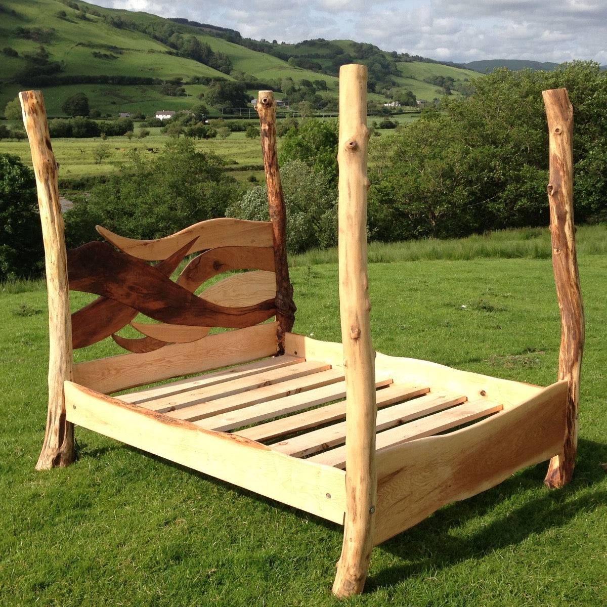 Unique handmade wooden bed frame in outdoor setting