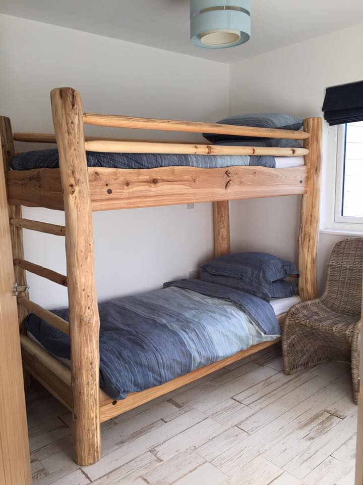 Eco-friendly driftwood bunk bed in cozy room