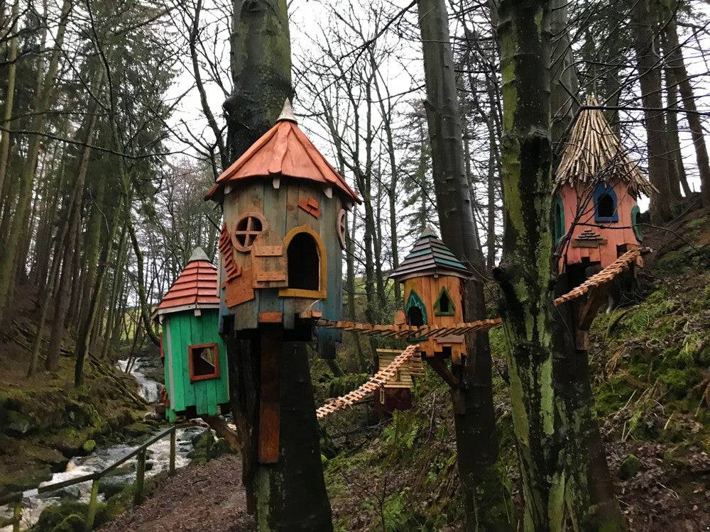 Fairy tree houses connected by wooden bridges