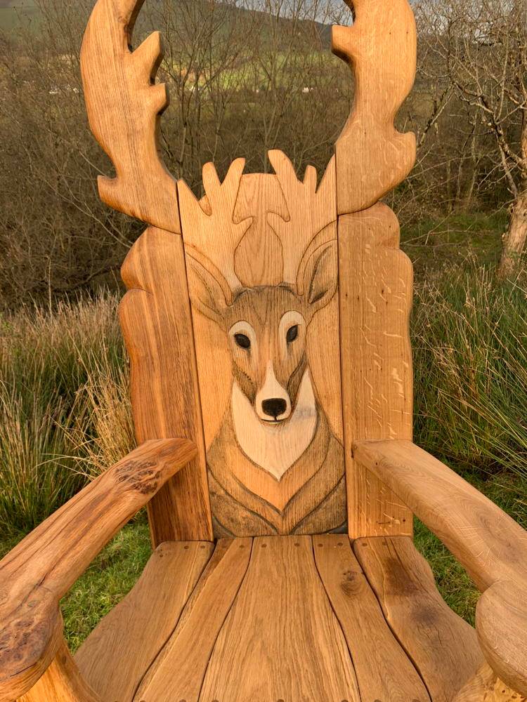 Stag Storytelling Chair with grassy background