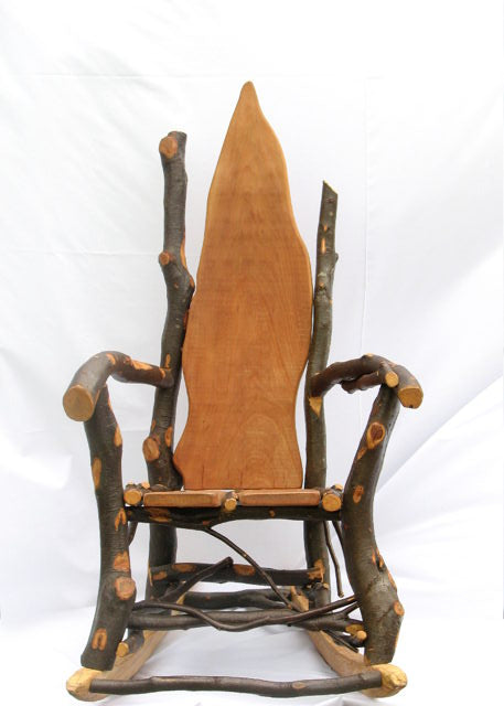 Front view of rustic wooden rocking chair with tall back