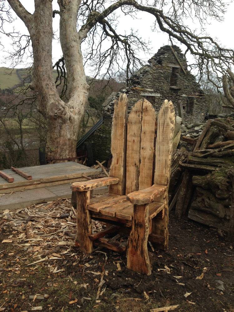 Side view of Giant Shrek Throne near tree